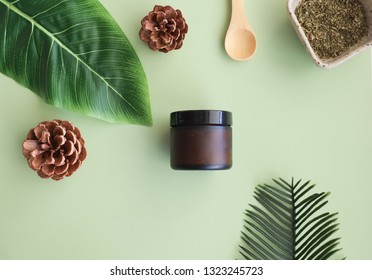 Beauty Cosmetic Skincare Background .Products With Flower ,leaves On Table Top View, Flat Lay.minimal Modern. Green Mockup