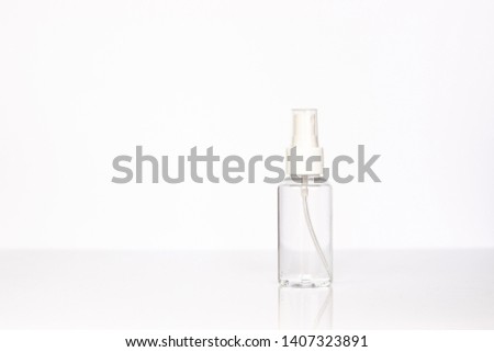 Beauty cosmetics glassbottle; branding mock up; front view on pastel white background. Package for essential oil.