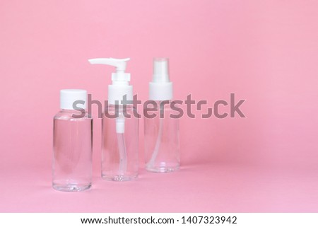 Beauty cosmetics glassbottle; branding mock up; front view on pastel pink background. Package for essential oil.