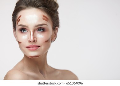 Beauty Cosmetics. Portrait Of Beautiful Sexy Female With Contouring And Highlighting Lines On Facial Skin. Closeup Of Attractive Young Woman With Fresh Natural Makeup Contour Lines. High Resolution