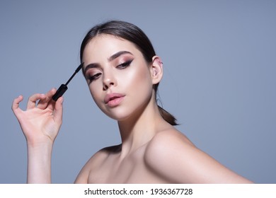 Beauty And Cosmetics. Woman Putting Black Mascara On Eyelashes. Perfect Makeup