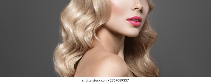 Beauty cropped portrait of a blonde young woman with pink lips amen up. Beauty salon and haircare concept. - Shutterstock ID 2367089337