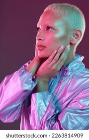 Beauty, cyberpunk and fashion black woman with unique style, makeup and hairstyle isolated in a studio neon background. Creative, artistic and bright and colorful female is trendy and stylish