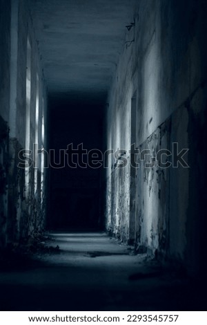 Beauty of decay - dark endless corridor of old abandoned building