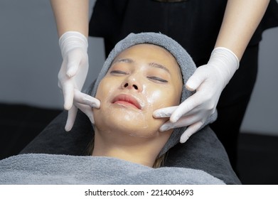 Beauty Expert Massaging Young Woman's Face, To Tighten Skin And Relax Face, Beauty Clinic, Close-up Focus On Face.