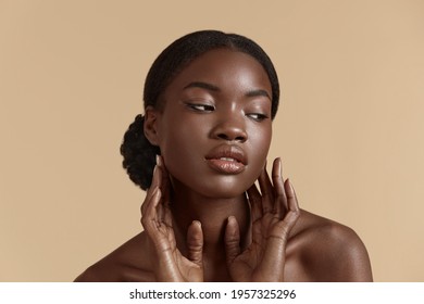 Beauty Face. Smiling Black Woman Touching Healthy Skin Portrait. Beautiful Girl With Glowing Skin And Natural Makeup`. Skin Care Concept
