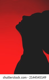 Beauty And Fashion Concept. Sensual Woman Black Face And Neck Silhouette With Flying Hairs In Vivid Red Color Gradient With Copy Space Background