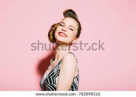 Beauty and fashion, cosmetics. Woman with retro hair and fashionable makeup, pinup. Makeup, hairdresser and cosmetics. Girl in stylish vintage dress on pink background. pinup, youth and look.