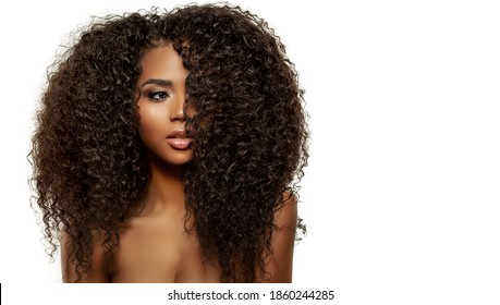 Beauty Fashion Model. Black Woman Face & Beautiful Voluminous Hair. Afro American Girl. Beauty Skin Female Face. 
Healthy Hair With Luxurious Updo Haircut. Waves, Curls Volume Hairstyle. Hair Salon.