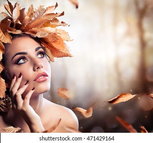 Beauty Fashion Model In Fall Forest
