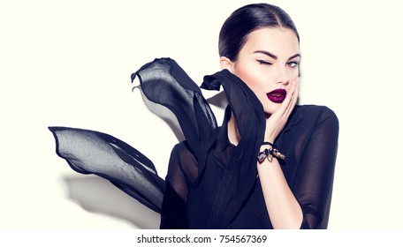 Beauty Fashion model girl with dark lips portrait, wearing stylish chiffon dress. Sexy woman portrait with perfect makeup and manicure, trendy accessories and fashion wear. Beauty trends