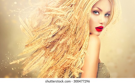 Beauty Fashion Model Girl With Gold Long Wheat Ears Hair. Beautiful Fashion Art Portrait Of Young Sexy Blonde Woman With Wheat Hairstyle. Organic Cosmetic Products For Healthy Hair Concept