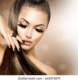 Beauty Fashion Model Girl with Long Healthy Brown Hair, Long Eyelashes. Fashion Trendy Caviar Black Manicure. Nail Art. Beautiful Stylish Woman with Healthy Smooth Skin. Ponytail. Perfect Makeup