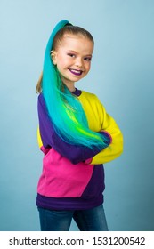 Beauty Fashion Model Kid Girl With Colorful Dyed Hair. Girl With Perfect Makeup And Hairstyle. Model With Perfect Healthy Dyed Hair. Rainbow Hairstyles