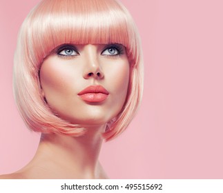 Beauty Fashion Model Portrait Pink Hair Color. Bob Short Haircut. Fringe Hairstyle. Hairdressing. Beautiful Glamour Girl With Short Blonde Hair. Dyed Hair, Perfect Makeup