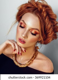 Beauty fashion model with professional make up. Red hair and freckles