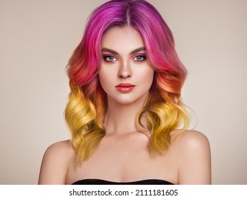 Beauty Fashion Model Woman with Colorful Dyed Hair. Girl with Perfect Makeup and Hairstyle. Model with Perfect Healthy Dyed Hair. Care and Beauty Hair Products