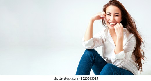 Beauty Fashion Portrait Of Smiling Sensual Asian Young Woman With Dark Long Hair In White Shirt On White Background Banner