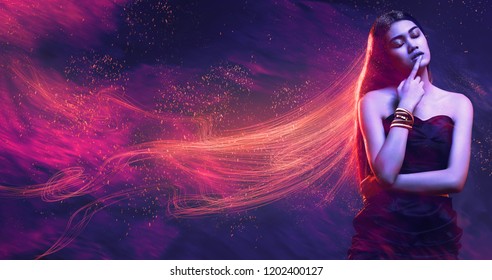 Beauty, fashion. Sensual woman in dress with red shiny hair in sparks