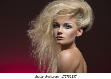 Beauty Fashion Shoot Of Sexy Woman With Naked Shoulders, Charming Bushy Creative Hair-style And Cute Make-up 