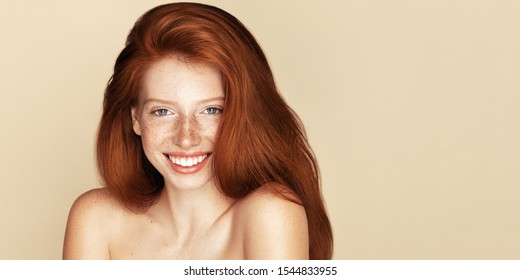 Beauty Freckles Young Girl Laughter Portrait. Attractive Model With Beautiful Natural Ginger Red Hair