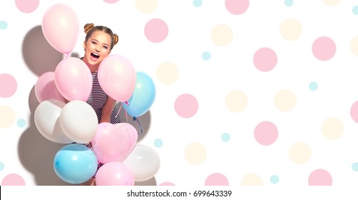 Beauty Girl With Colorful Air Balloons Laughing Isolated On White Background. Beautiful Happy Young Woman On Birthday Holiday Party. Joyful Model Having Fun And Celebrating. Polka Dots Background.