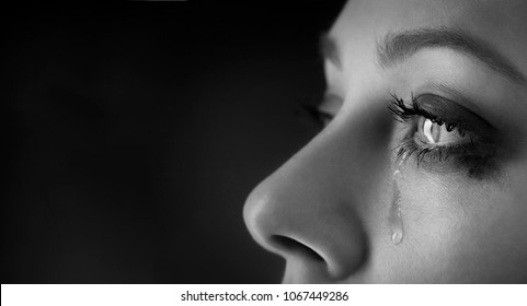 beauty girl cry on black background - Shutterstock ID 1067449286