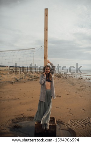 Beauty girl in dress on sea beach