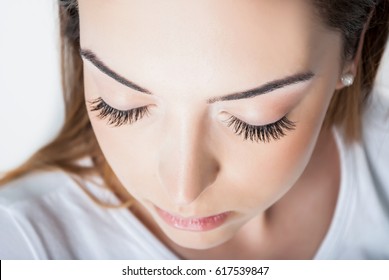 Beauty Girl With Extended Silk Eyelashes And Eyes Closed In A Beauty Salon, Close Up