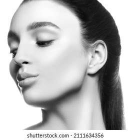 Beauty Girl Face Close-up. Sensual Young Woman Brunette Hair And Beautiful Neck Studio Profile Portrait. Studio Shot. Skincare Facial Treatment Health Concept.Monochrome