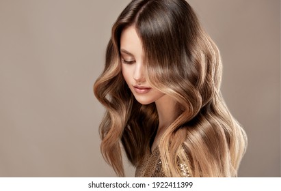 Beauty  Girl With Long  And   Shiny Wavy  Hair ,coloring And Toning, Shatush And Balayash .  Beautiful   Woman Model With Curly Hairstyle .