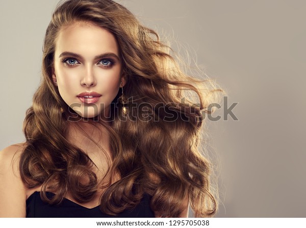 Beauty Girl Long Shiny Wavy Hair Stock Photo (Edit Now) 1295705038