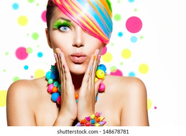 Beauty Girl Portrait with Colorful Makeup, Hair, Nail polish and Accessories. Colourful Studio Shot of Funny Surprised Woman. Vivid Colors