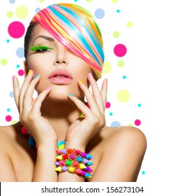 Beauty Girl Portrait with Colorful Makeup, Hair, Nail polish and Accessories. Colourful Studio Shot of Stylish Woman. Vivid Colors. Manicure and Hairstyle. Rainbow Colours 