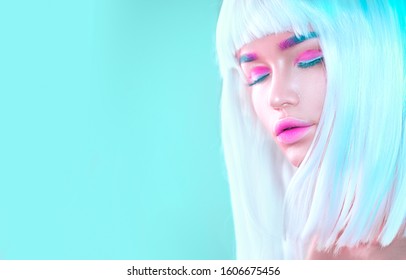 Beauty high fashion model girl portrait and white short hair  trendy pink eyeliner  gradient lips  Futuristic art make  up in white  blue   pink  Beautiful makeup  colorful eyebrows  Make up artist