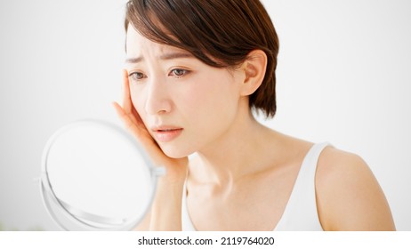 Beauty Image of young woman taking care of her skin - Shutterstock ID 2119764020