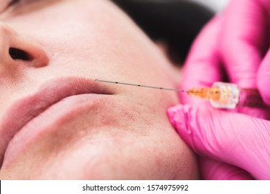 Beauty Injections Close Up. Lip Filler Injection. Cropped Image With Space For Text