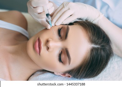beauty injections into beautiful face. smoothing of mimic wrinkles around the eyes using biorevitalization - Shutterstock ID 1445337188