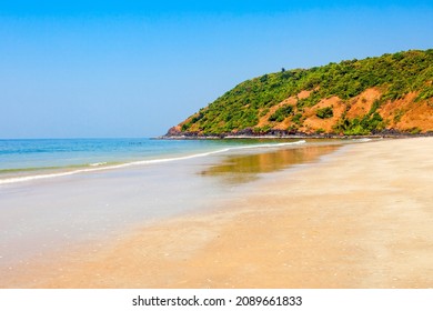 Beauty lonely beach with yellow sand in Goa, india