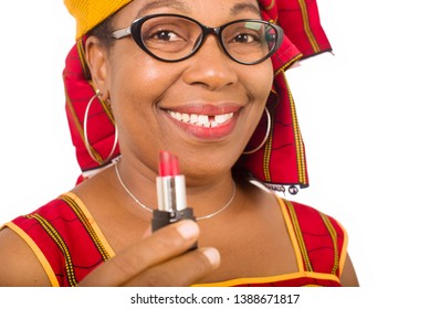 beauty, makeup and elderly concept in red african outfit - senior woman is holding a lipstick on white background. - Powered by Shutterstock