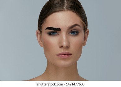 Beauty Makeup. Woman Coloring Eyebrow With Gel Tint Portrait. Girl Model Setting Liquid Peel-off Brow Gel On Eyebrow 