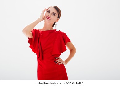 Beauty model in red dress. white background