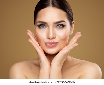 Beauty Model showing Cheekbones and Full Lips. Beautiful Woman Face Skin Care. Women Dermal Filler and Permanent Make up Cosmetology. Lip Augmentation Facial Lifting Spa Massage