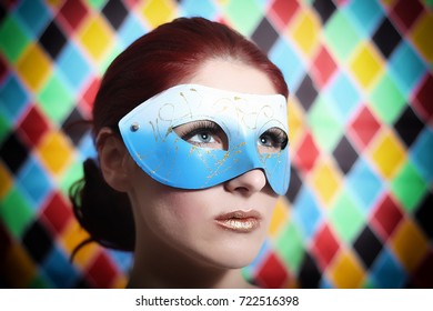 Beauty model woman wearing venetian masquerade carnival mask,  colorful  background with magic glow. - Shutterstock ID 722516398