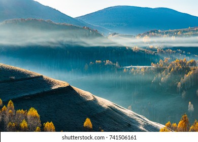 The beauty of morning light that heat the misty mountains of Transylvania