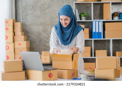 Beauty Muslim Woman In Hijab Working In The Office