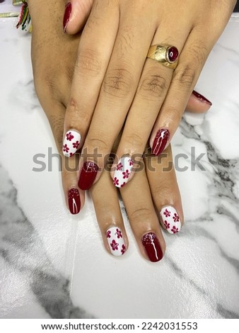 Beauty nails art maroon colour with floral pattern