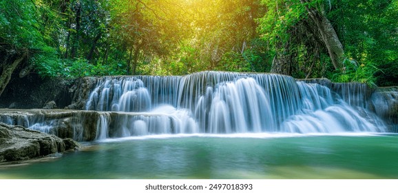 Beauty in nature, amazing waterfall in tropical forest of national park, Thailand - Powered by Shutterstock