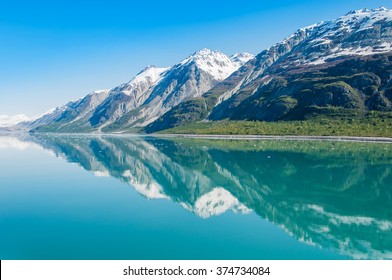 The beauty of North America | Alaska: Picturesque view of the mountains reflecting in still water of Glacier Bay in  Alaska, United States.