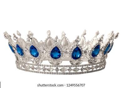 Beauty Pageant Winner, Bride Accessory In Wedding And Royal Crown For A Queen Concept With A Silver Tiara Covered In Crystals, Diamond And Blue Sapphire Stones Isolated On Withe With Clip Path Cutout